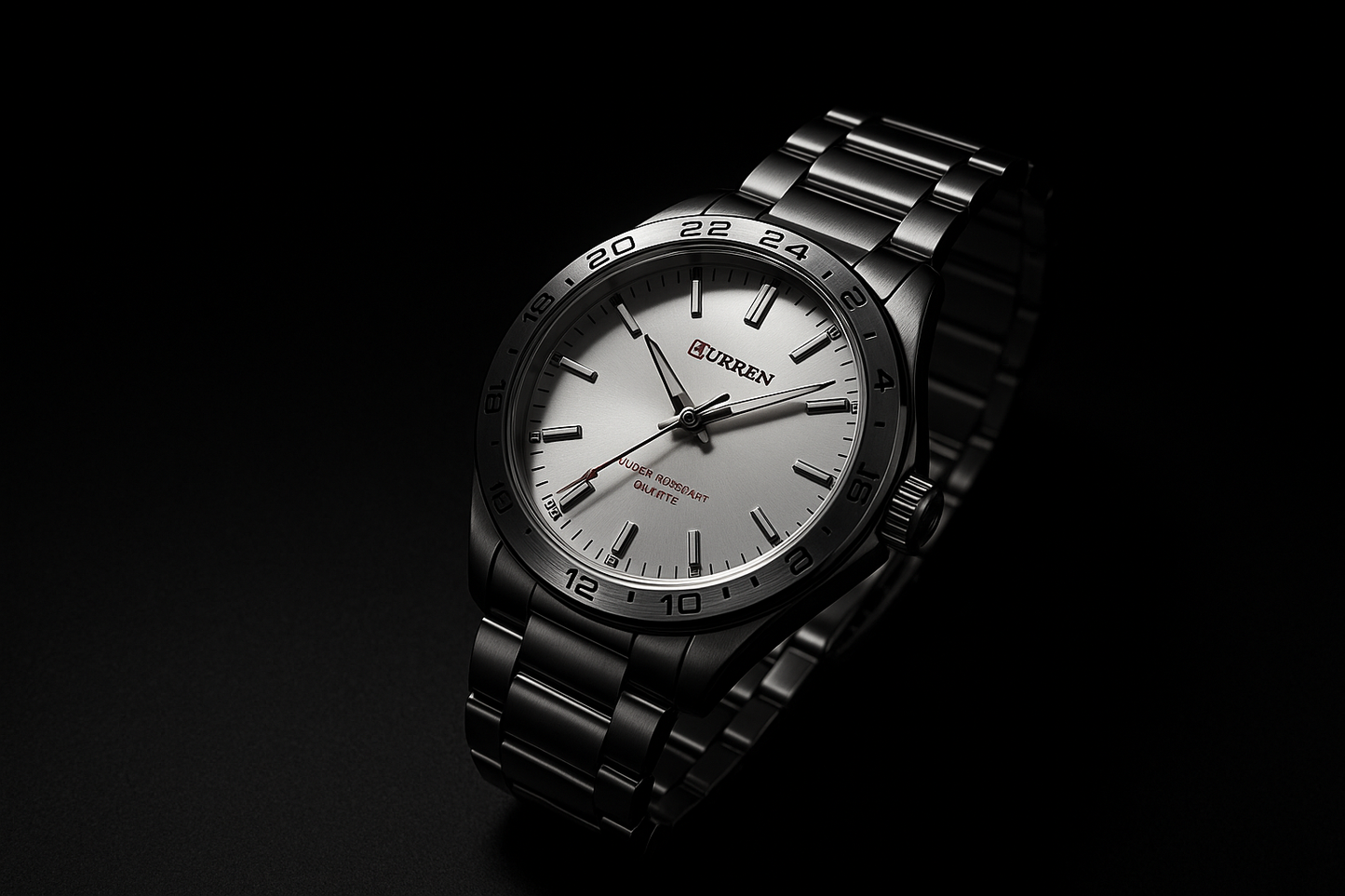 Black wristwatch with silver dial on a black background