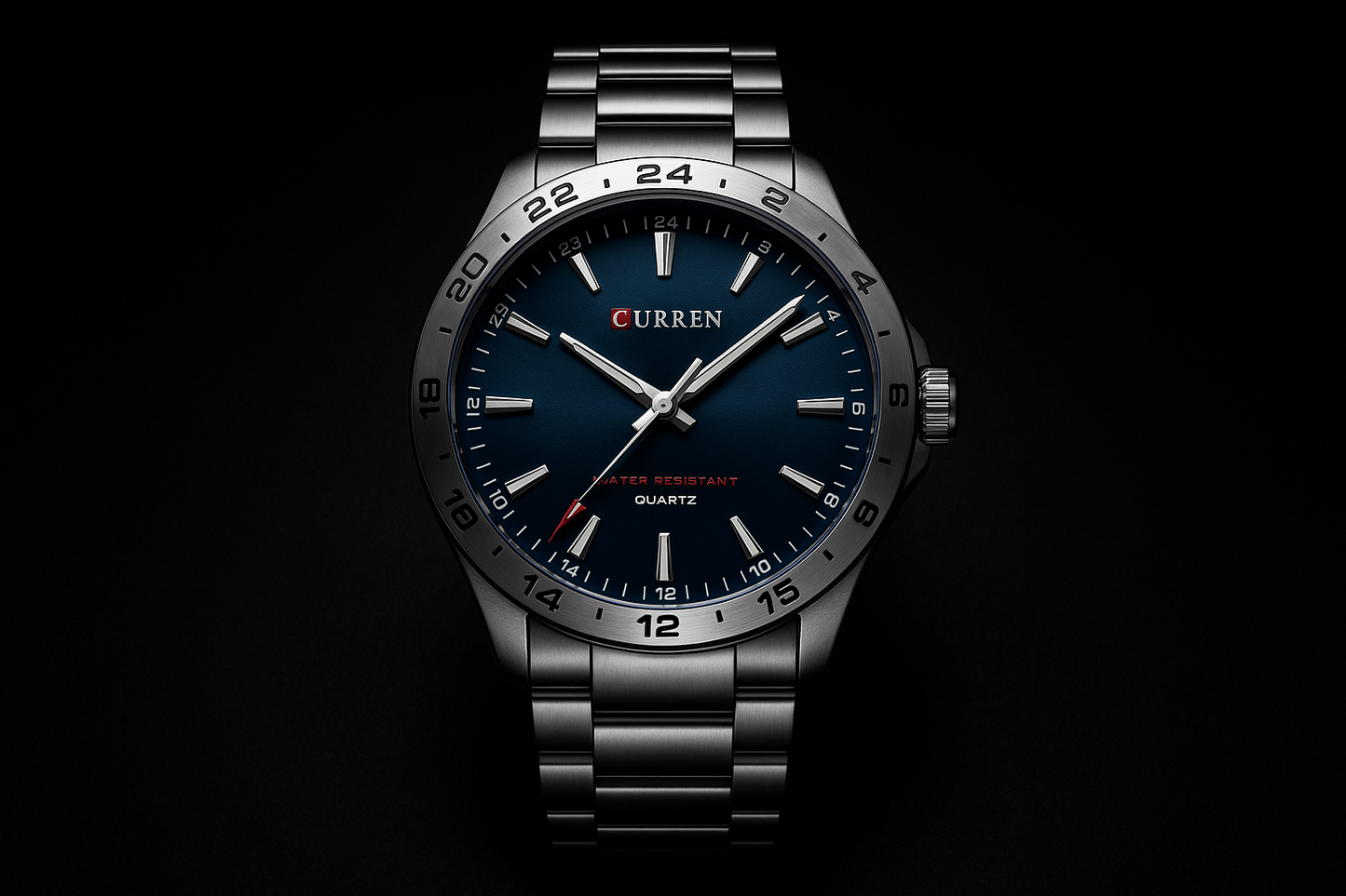 watch with blue dial and silver metal strap on black background