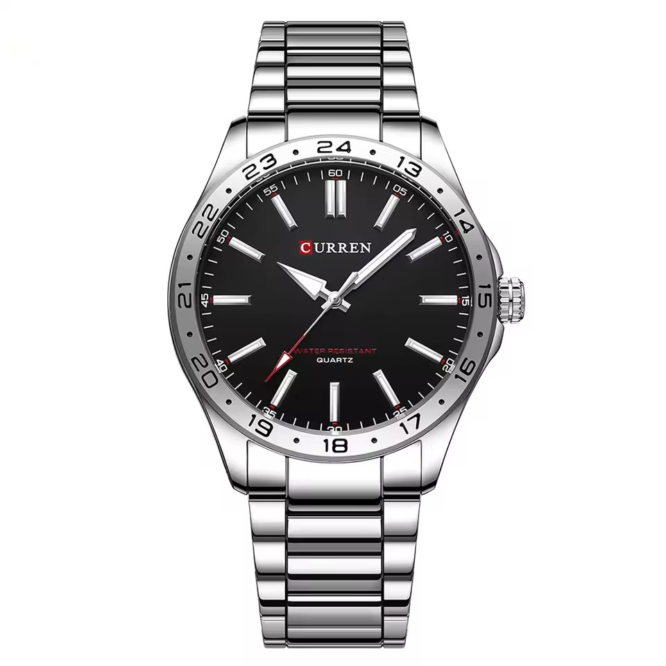 Curren watch with black dial and silver metal strap on a white background