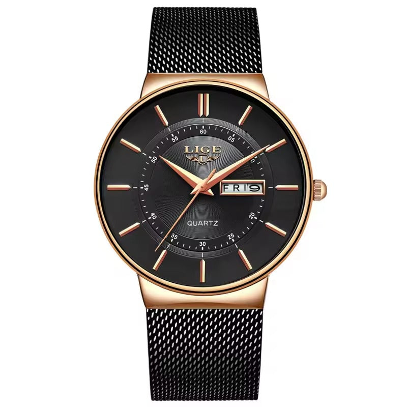 A black analog watch with a mesh band and a black dial, featuring rose gold accents and a branded logo at the top.