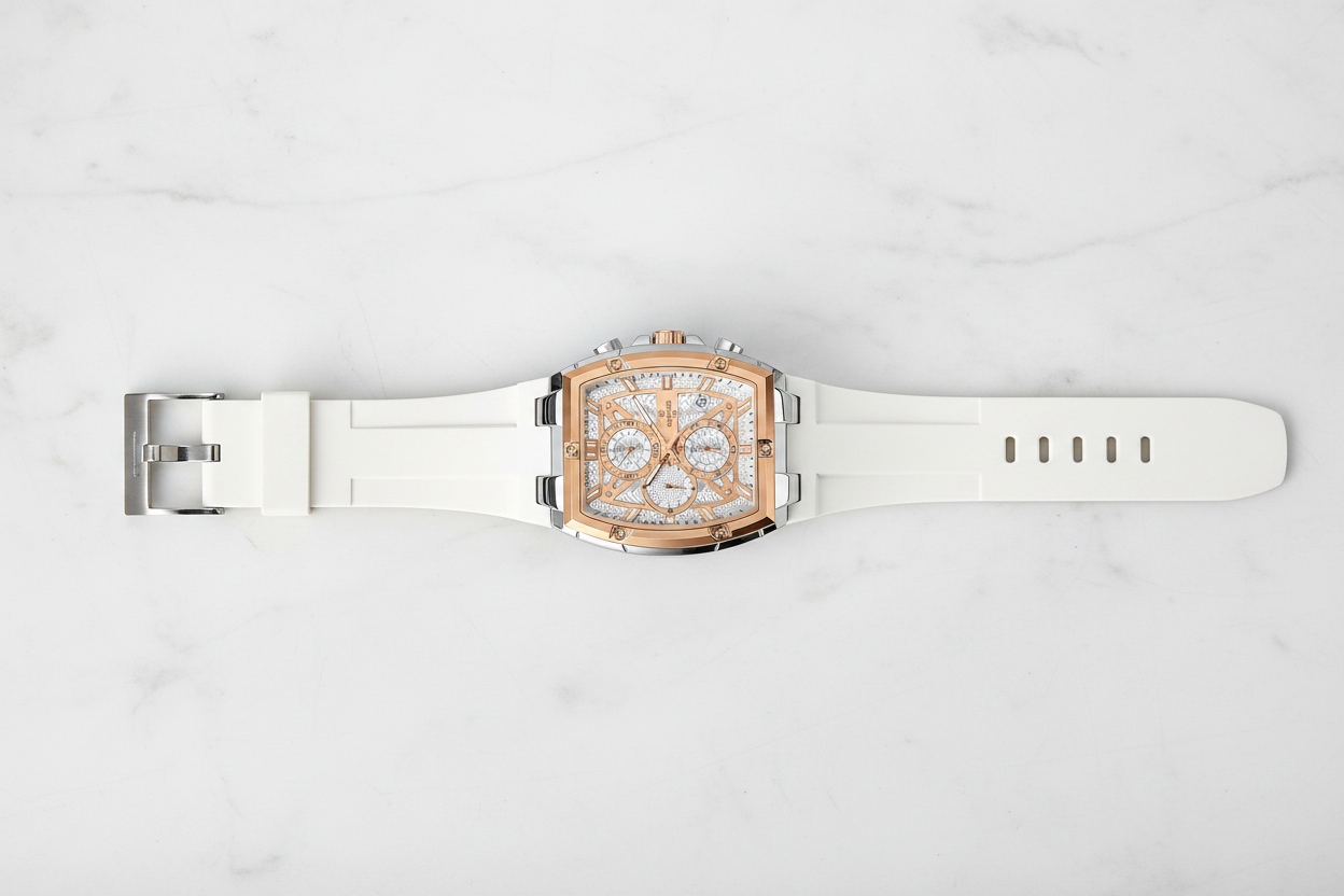 Watch with open strap on table